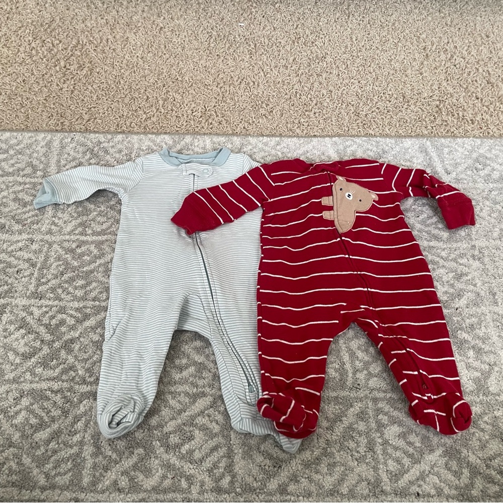 Two long sleeve onesies by Carter's in a size 3 months.